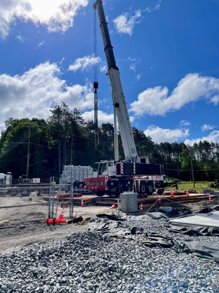 Contractor using World Forest Group Eucalyptus timber mats for ground protection under heavy crane. Transmission substation.